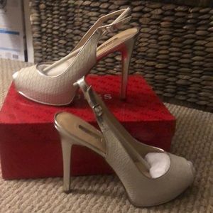 Silver snakeskin platform pumps